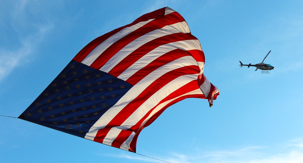 Compass Mining, U.S. flag and helicopter